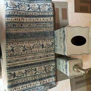 Shower curtain with tissue holder and soap pump.